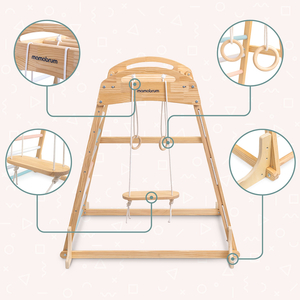 Medinė žaidimų aikštelė viduje su sūpynėmis, gimnastikos žiedais ir laipiojimo tinklu